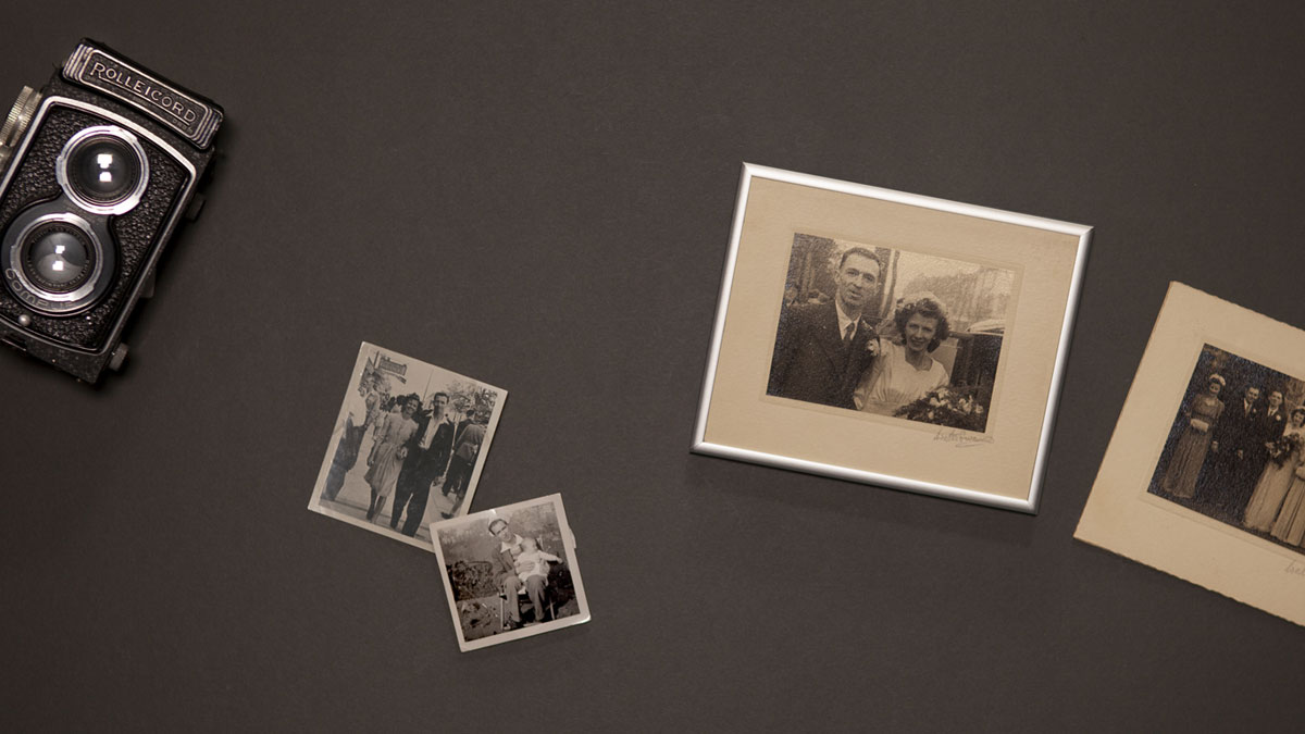 Old family photos framed next to Rolleicord camera